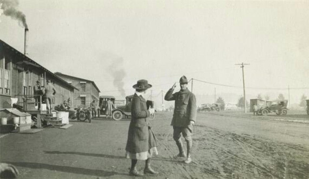 1918: Col. Joseph W. Jackson salutes a woman in civilian dress at Camp Lewis. (Photo courtesy Wisconsin History)